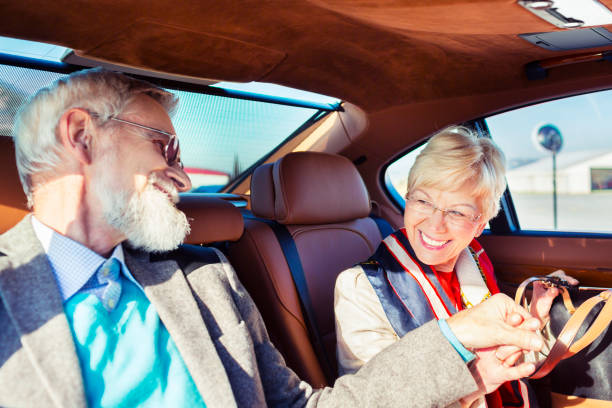 Couple enjoying a luxury private car transfer with RhomTrip - premium ground transportation for travelers worldwide